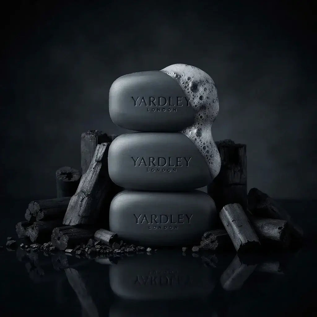 Yardley London activated charcoal bath bar stacked with charcoal, showcasing its moisturizing and purifying properties.